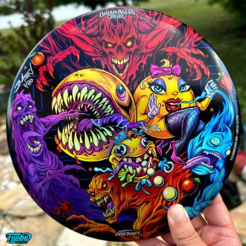 Colorful illustration parody of Pac-Man, Ms. Pac-Man, and Baby Pac-Man eating the ghosts from the retro arcade game drawn by Brian Allen and printed on a Discraft Buzzz Disc
